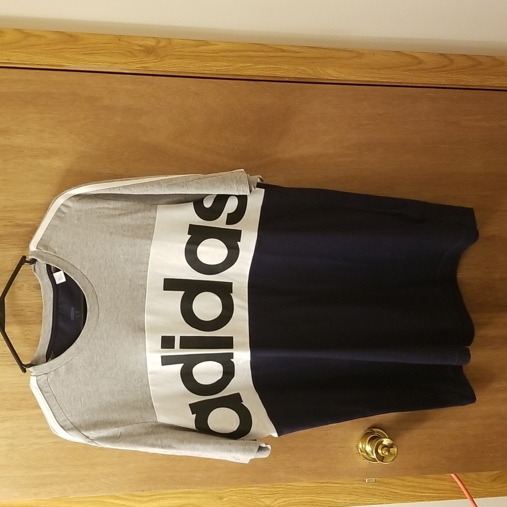 Adidas.  Size large. Navy, gray and white with stripes.